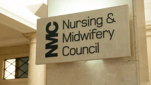 A marble block with the words Nursing and Midwifery Council written on it
