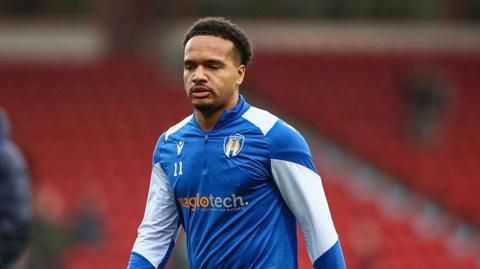 John-Kymani Gordon in his Colchester United training kit before kick-off