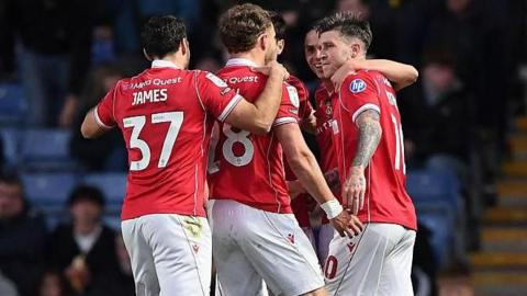 Wrexham players celebrate Josh Windass' goal