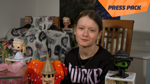 Evie with Wicked merch