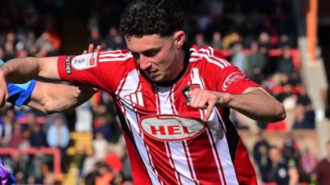 Charlie Cummins in action for Exeter