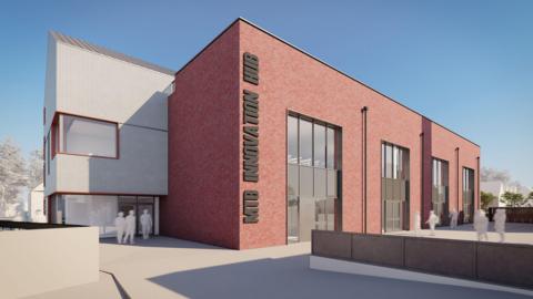 An artist's impression of the mountain bike hub with a big brick building under blue skies