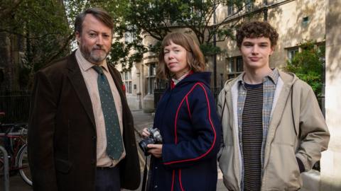 David Mitchell as John 'Ludwig" Taylor, Anna Maxwell Martin as Lucy and Dylan Hughes as Henry in Ludwig