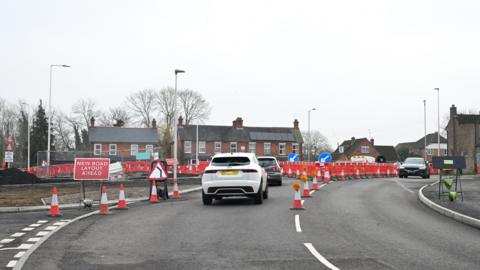 A picture of cars driving around the area that is being affected by the South Wokingham Distributor Road project.
