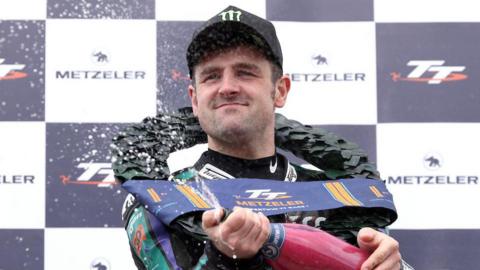 Michael Dunlop on the top step of the podium at the 2024 Isle of Man TT