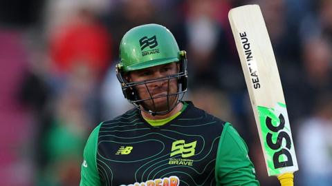 Southern Brave batter Jason Roy raises his bat after reaching his fifty