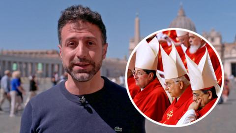Reporter in St Peter's Sq with cardinals in a cut-out