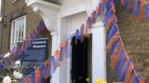 The outside of Chatteris museum which has been decorated with purple and orange streamers and garlands. 