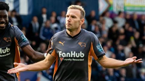 Andi Weimann celebrates his winner at West Brom