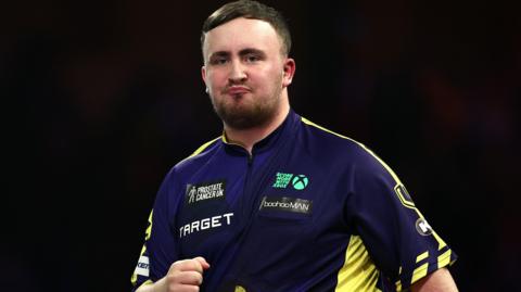 Luke Littler purses his lips during the PDC World Championship