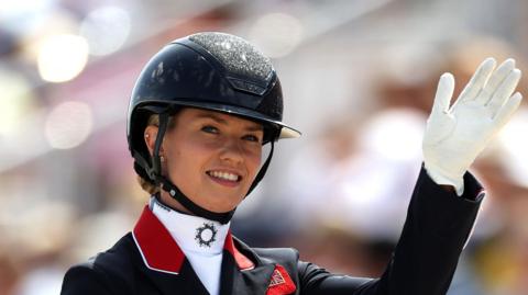 Lottie Fry waves to the crowd aboard Glamourdale


