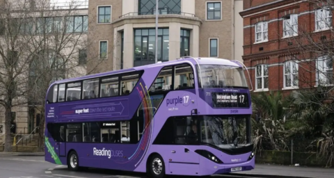 Purple double decker Reading Bus at a bus stop