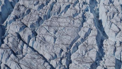 greenland's ice sheet, covered in cracks