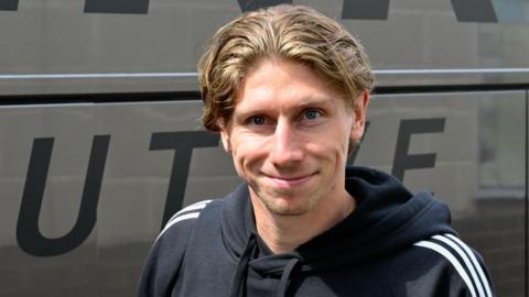 Alex Hartridge gets off the team coach during last season's loan spell at Exeter City