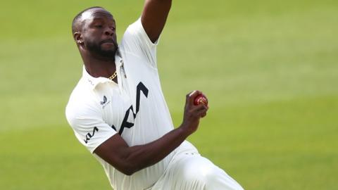 Kemar Roach bowling for Surrey