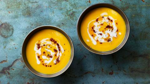 Two bowls of sweet potato soup