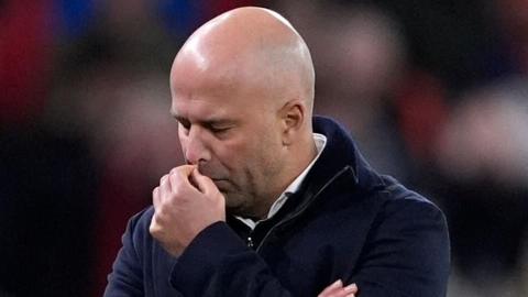 Liverpool manager Arne Slot with his eyes closed