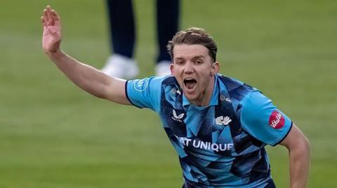 Yorkshire bowler Matt Milnes celebrates a wicket