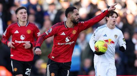 Matheus Cunha celebrates after equalising for Manchester United at Leeds in the Premier League
