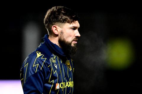 Tom Bradshaw warming up