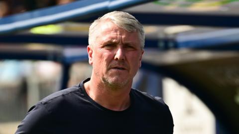 Lee Clark watches Rotherham United from the touchline earlier this month