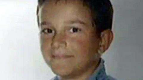 Fernando Blasco Baselga looking at the camera.  He has short, brown hair and is wearing a blue top.
