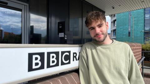 Mitchell Barwell stood outside the BBC Radio Derby entrance