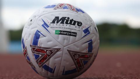 A National League matchball on an athletics track