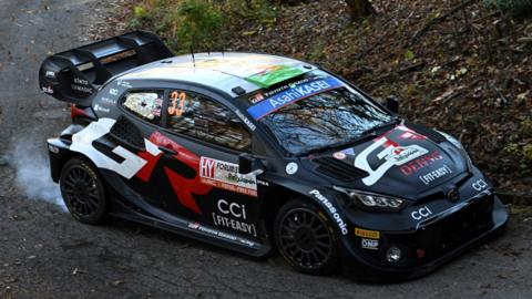 Elfyn Evans and his co-driver Scott Martin of Great Britain drive their Toyota in Rally Japan