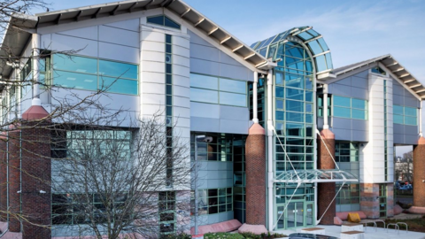 A modern glass building of where Reading's new police station will be in Whitley.