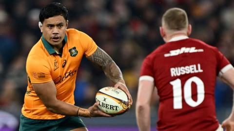 Len Ikitau (left) in action for Australia against the British and Irish Lions