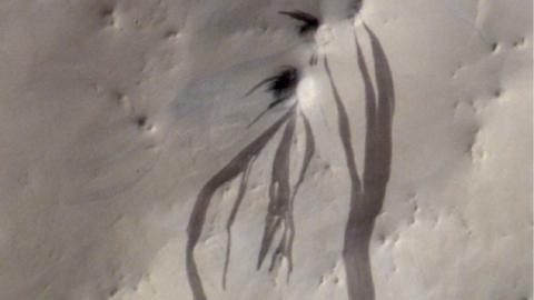 Picture showing some dark 'streaks' on Mars.