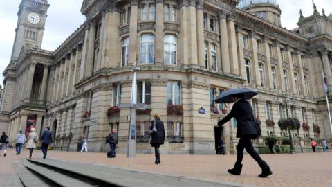 People near Birmingham City Council's buildings