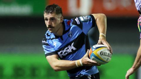 Harri Millard runs with the ball for Cardiff