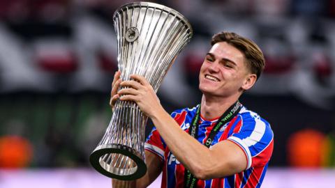 Justin Devenny with the Uefa Conference League trophy