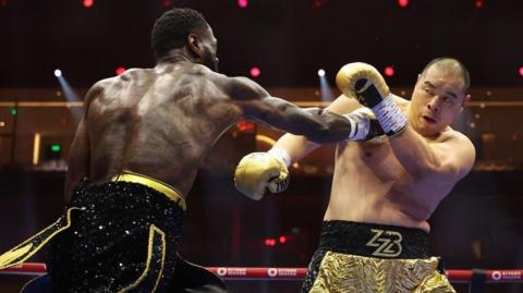 Deontay Wilder aims a punch