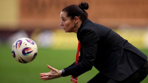 Rhian Wilkinson throws the ball on the touchline 
