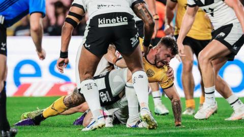 Liam Hood burrows his way over the line to score Castleford's winning try in their 18-14 success at Hull FC.