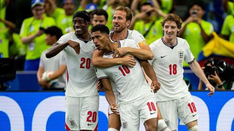 Jude Bellingham celebrates scoring England's third goal with Noni Madueke, Harry Kane and Anthony Gordon.