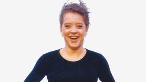 Vicky Glass, smiling and wearing a black top with a round neck.