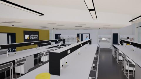 A CGI image of what the new pharmacy labs could look like at the University of Suffolk. The lab has long white tables with sinks and taps installed in them. Chairs line the length of each table. Some people stand in the doorway at the back of the room.