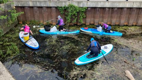 Volunteers clean up the river