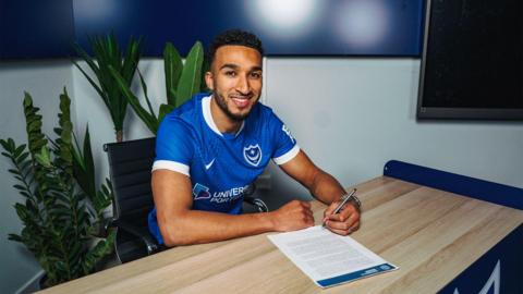 Jacob Brown poses for a photo after signing his Portsmouth contract