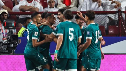 Iraq celebrate scoring against the United Arab Emirates in World Cup qualifying