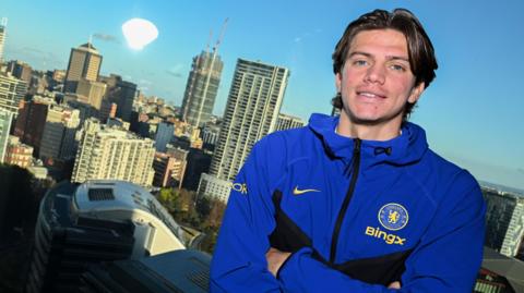 Marco Palestra folding his arms from Chelsea's team hotel