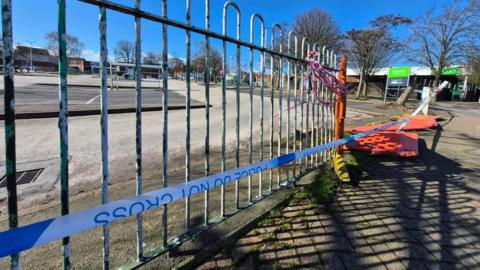 A police cordon by railings