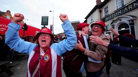 Aston Villa fans celebrate their side's second goal of the game during a screening of the Europa League Final, at Witton Arms, Birmingham