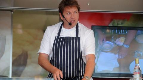 James Martin performs a cookery demonstration during the Festival of Food and Wine race day at Ascot Racecourse in 2013