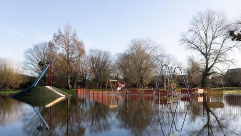 A flooded playground in Surrey.