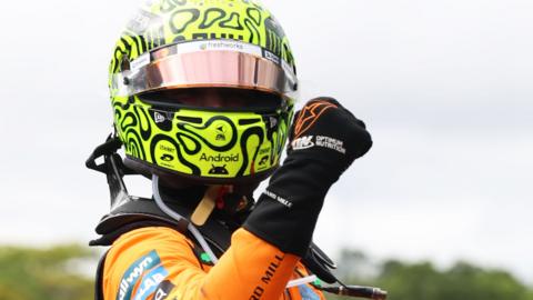 McLaren's Lando Norris pumps his fist in celebration after winning the Sao Paulo Grand Prix